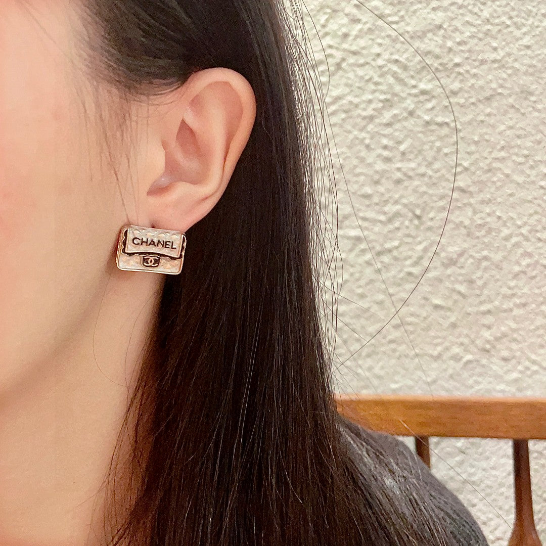 Double-C Emblem Stud Earrings in Polished Metal-Tone – Design 152 detail view