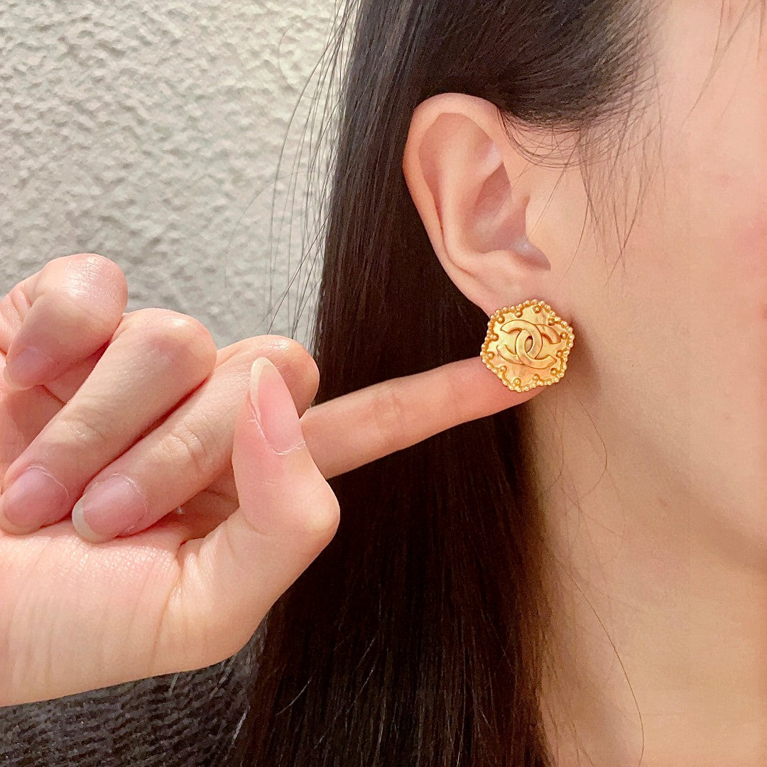 Double-C Emblem Stud Earrings in Polished Metal-Tone – Design 150 front product view