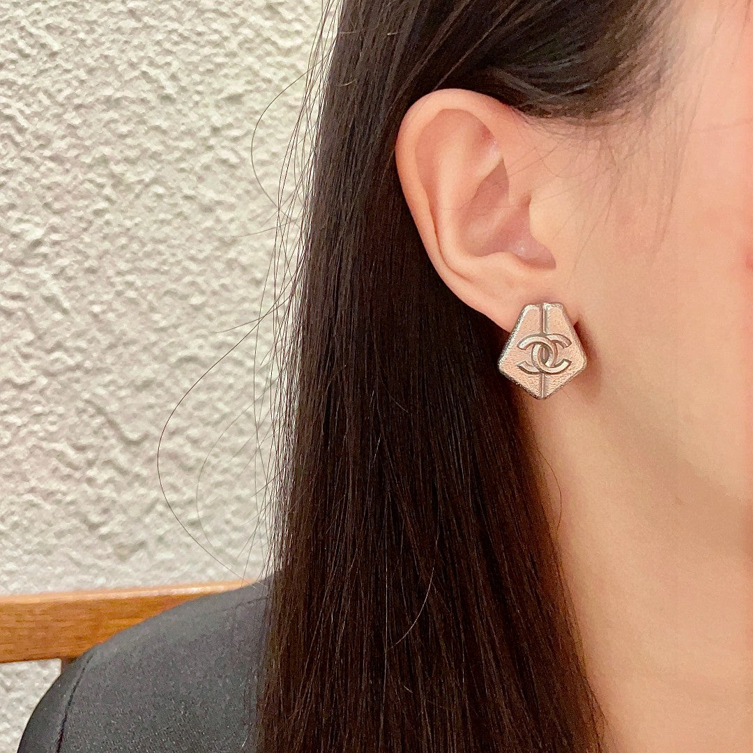 Double-C Emblem Stud Earrings in Polished Metal-Tone – Design 146 detail view