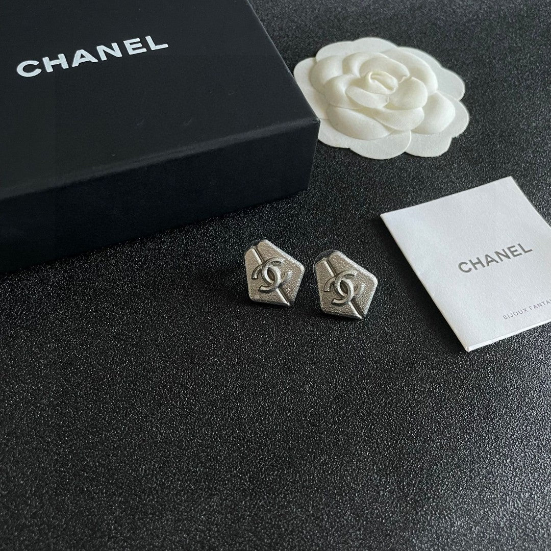 Double-C Emblem Stud Earrings in Polished Metal-Tone – Design 146 styled product view