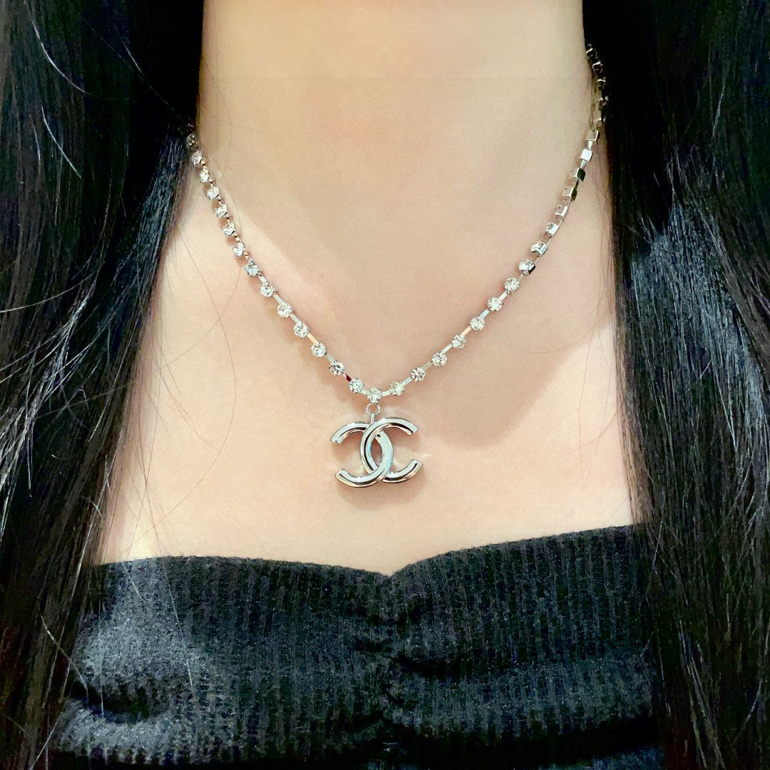 Double-C Emblem Pendant Necklace in Polished Metal-Tone – Design 011 detail view
