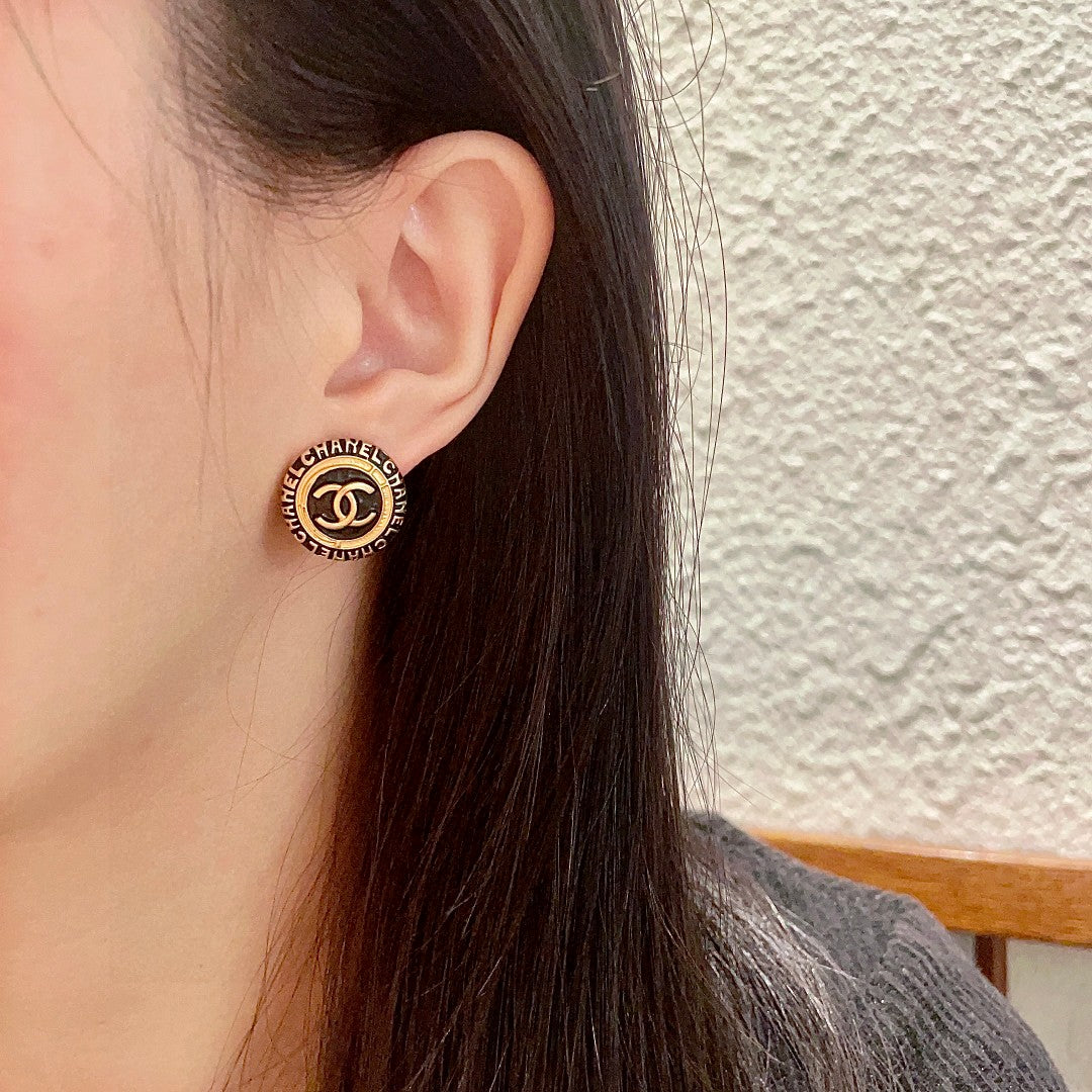 Double-C Emblem Stud Earrings in Polished Metal-Tone – Design 144 detail view