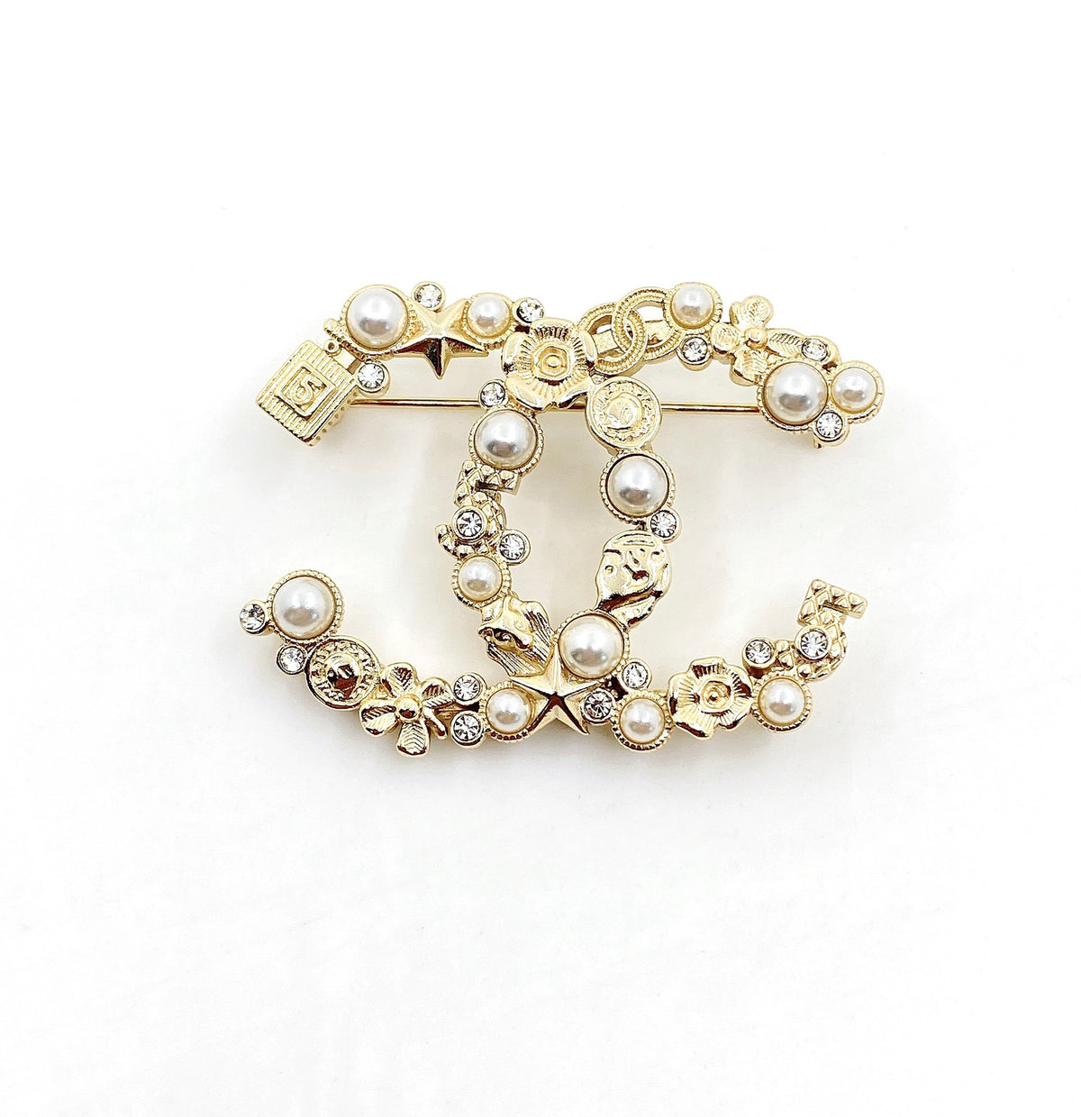 Signature Emblem Brooch in Polished Metal-Tone – Design 009 close-up detail