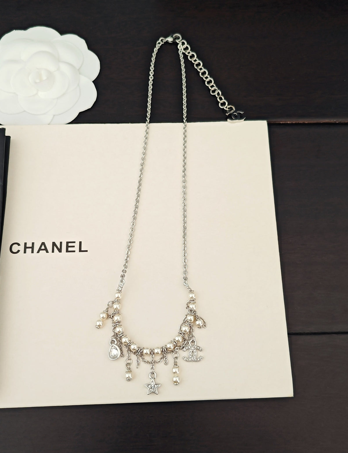 Signature Emblem Pendant Necklace in Gold-Tone – White Detail close-up detail