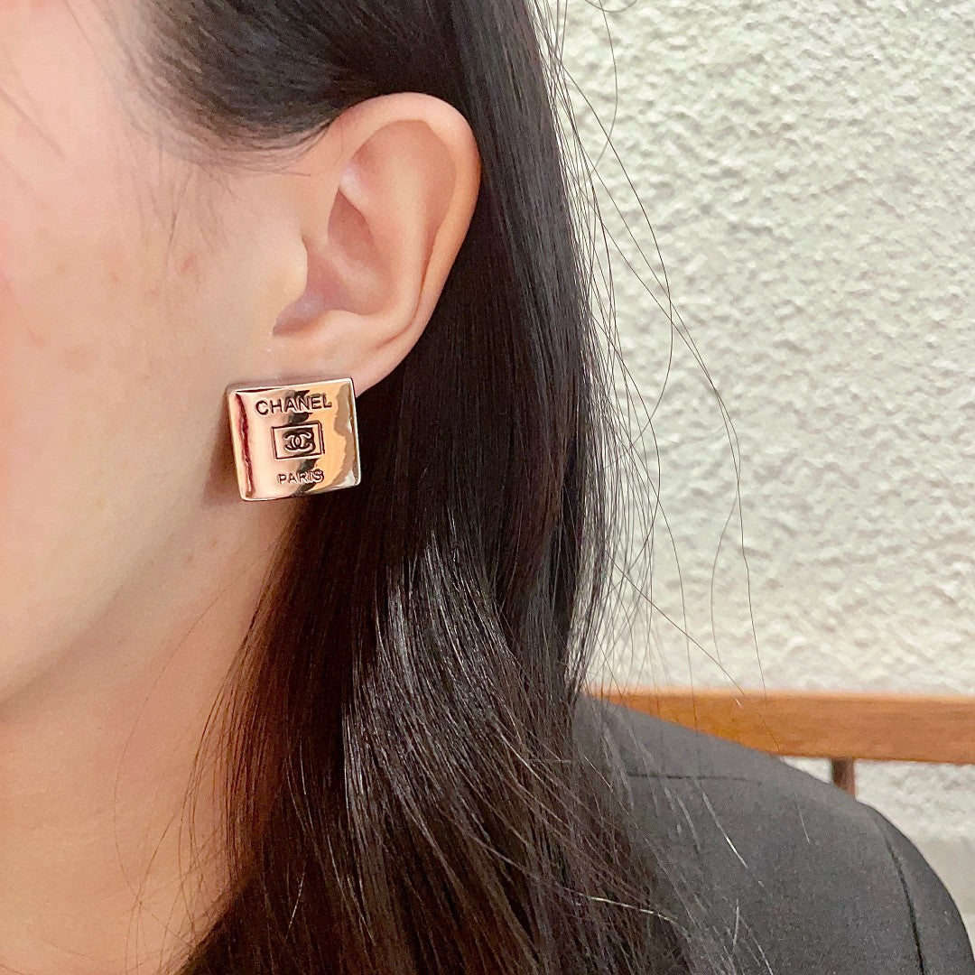 Double-C Emblem Stud Earrings in Polished Metal-Tone – Design 265 detail view