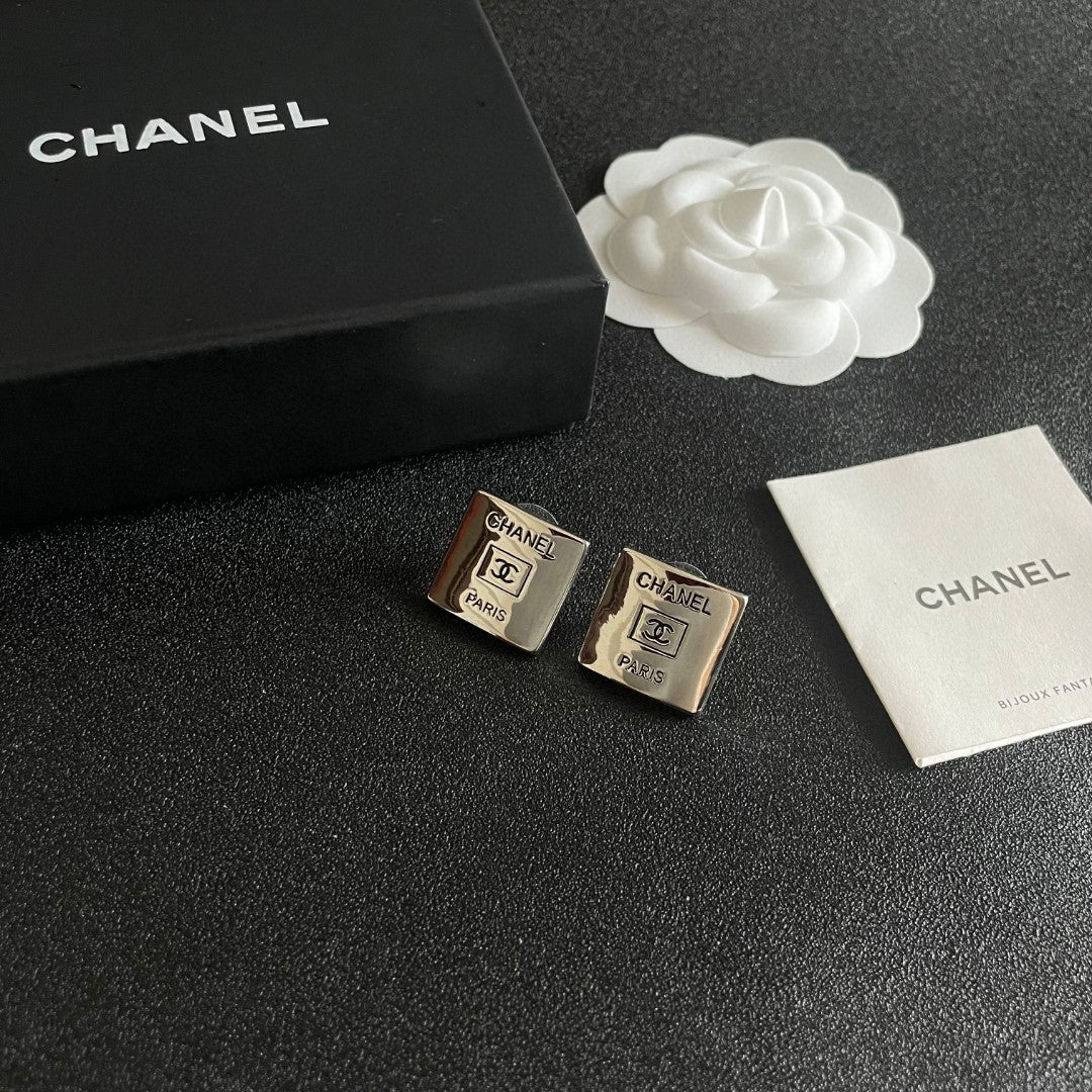 Double-C Emblem Stud Earrings in Polished Metal-Tone – Design 265 styled product view
