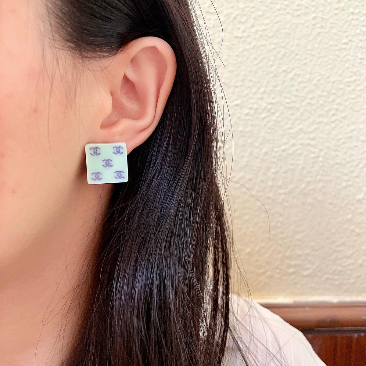 Double-C Emblem Stud Earrings in Polished Metal-Tone – Design 274 detail view