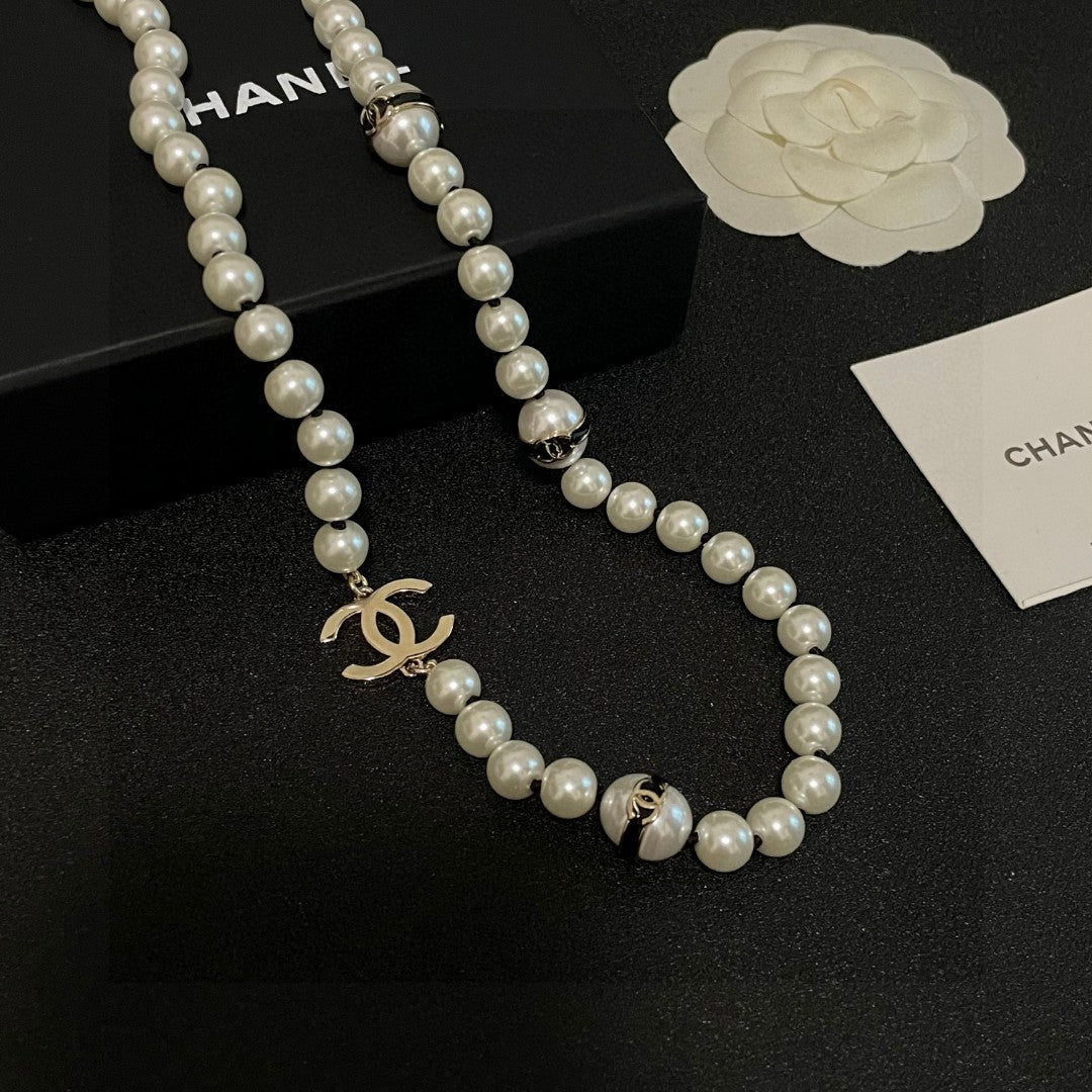 Double-C Emblem Pearl-Detail Pendant Necklace – Pearl Detail – Design 100 close-up detail