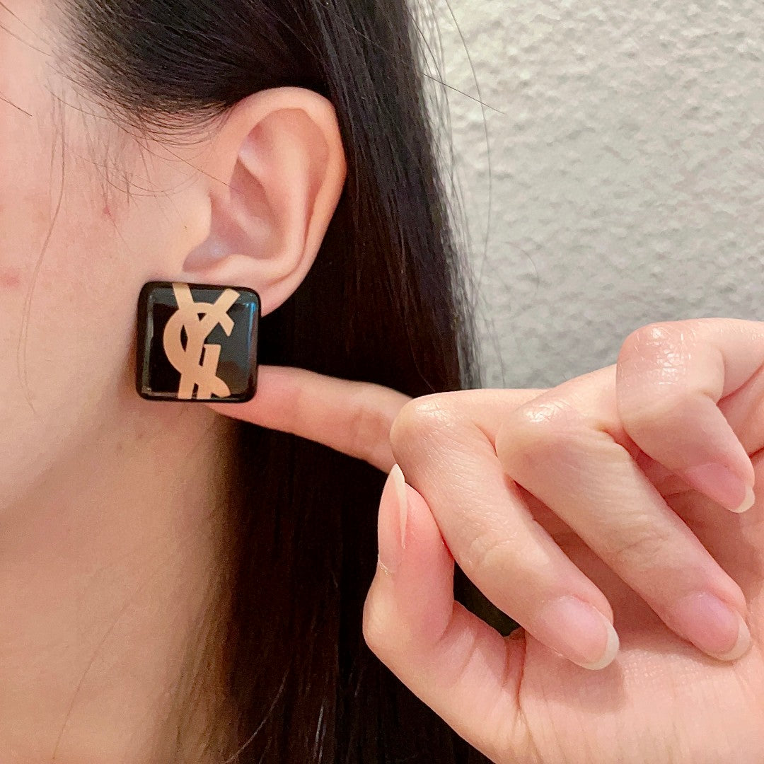 Letter Emblem Stud Earrings in Polished Metal-Tone – Design 003 front product view