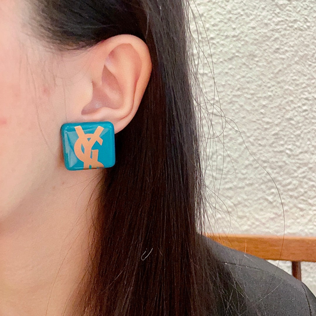 Letter Emblem Stud Earrings in Polished Metal-Tone – Design 002 detail view