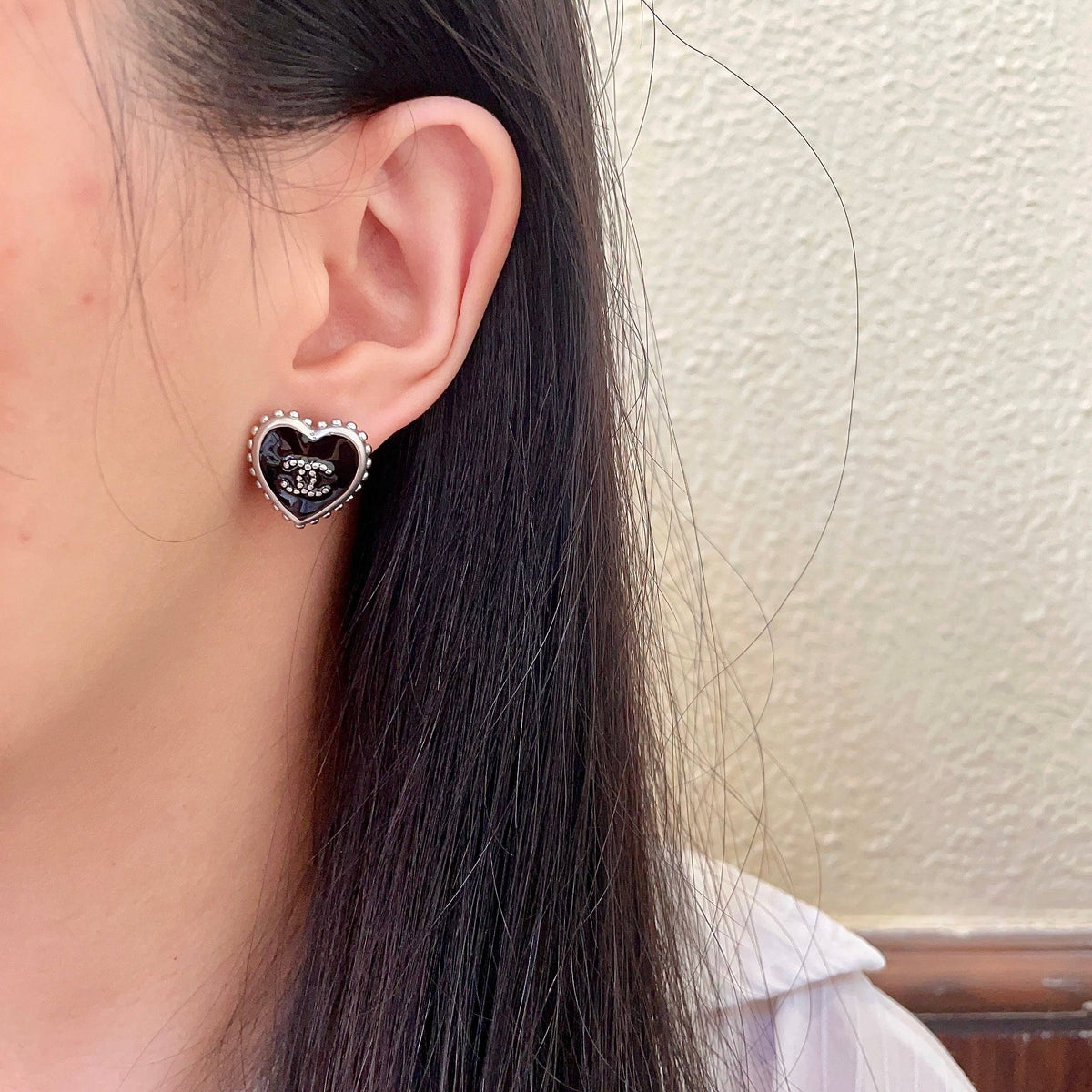 Double-C Emblem Stud Earrings in Polished Metal-Tone – Heart Detail – Design 012 detail view