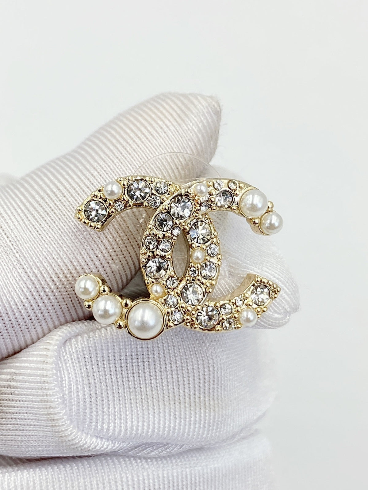 Double-C Emblem Pearl-Detail Stud Earrings – Pearl Detail – Design 007 detail view