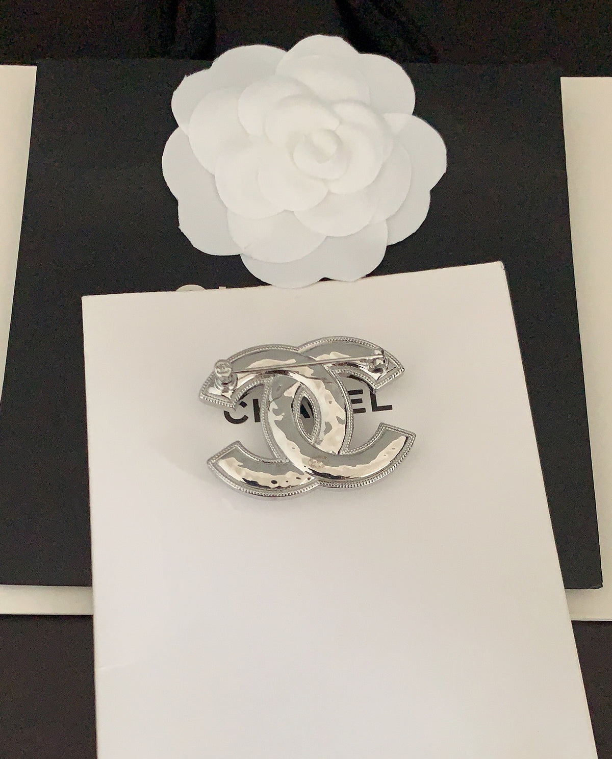 Signature Emblem Brooch in Gold-Tone – White Detail front product view