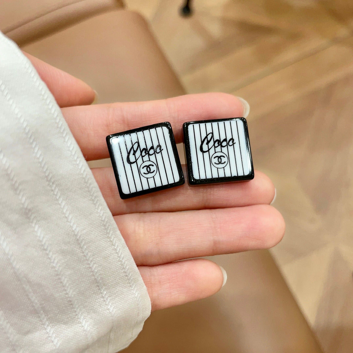Double-C Emblem Stud Earrings in Polished Metal-Tone – Design 177 side detail