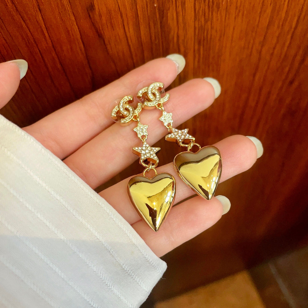 Double-C Emblem Statement Earrings in Polished Metal-Tone – Heart Detail – Design 003 side detail