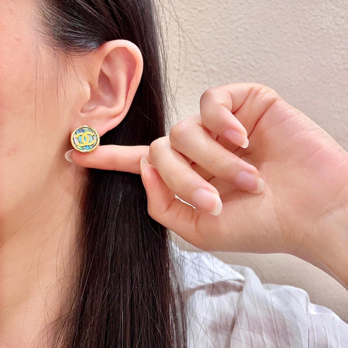 Double-C Emblem Stud Earrings in Polished Metal-Tone – Design 300 front product view