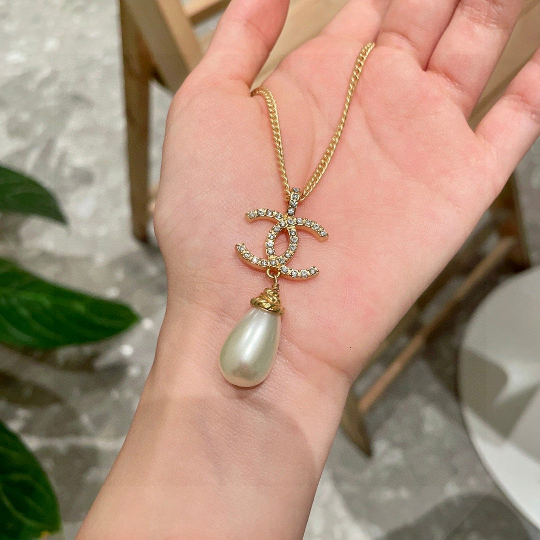 Double-C Emblem Pearl-Detail Pendant Necklace – Pearl Detail – Design 131 side detail