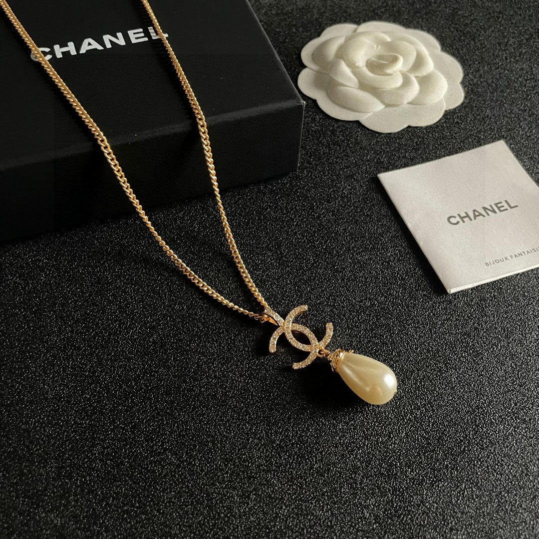 Double-C Emblem Pearl-Detail Pendant Necklace – Pearl Detail – Design 129 styled product view