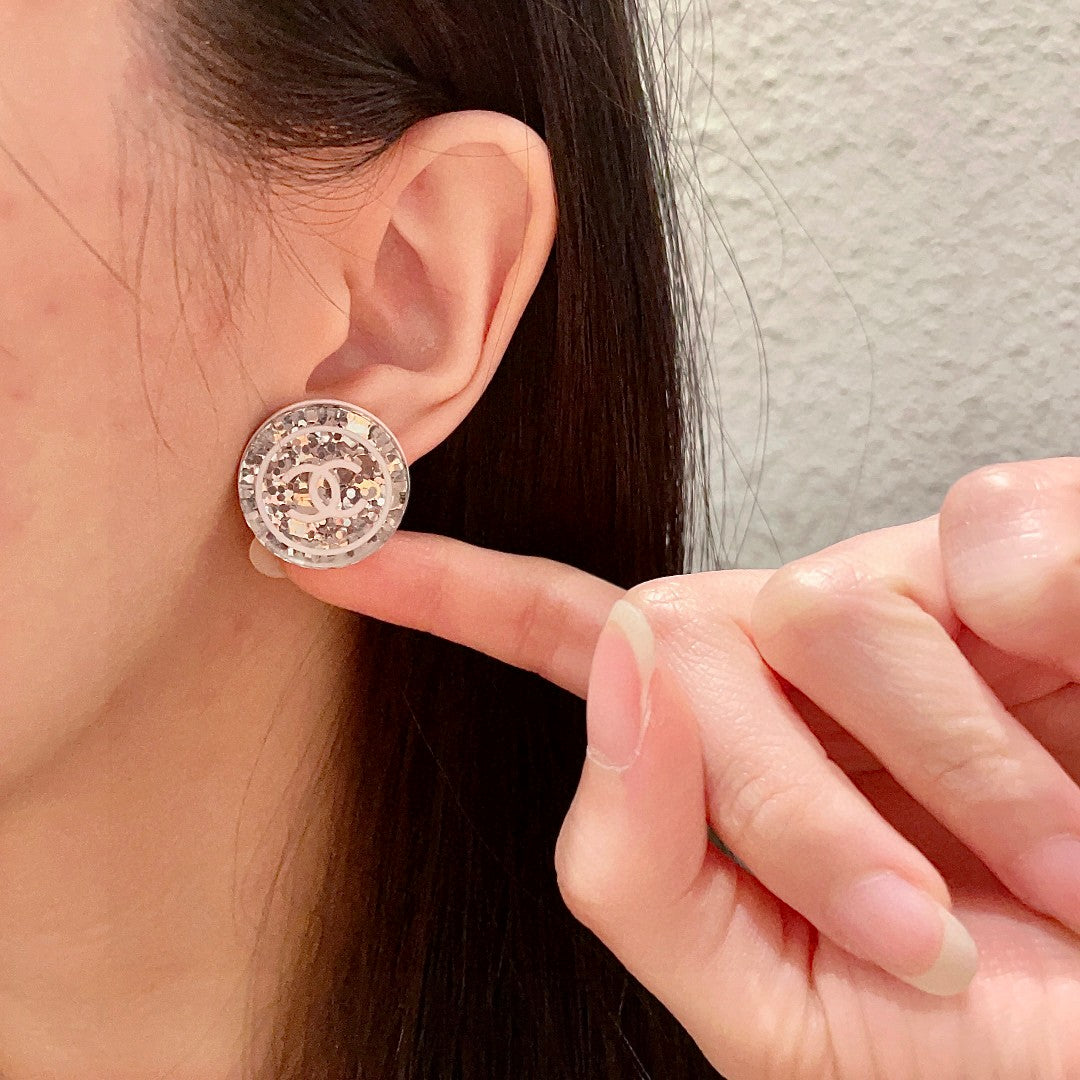 Double-C Emblem Stud Earrings in Polished Metal-Tone – Design 181 front product view