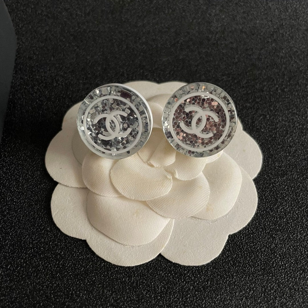 Double-C Emblem Stud Earrings in Polished Metal-Tone – Design 181 front product view