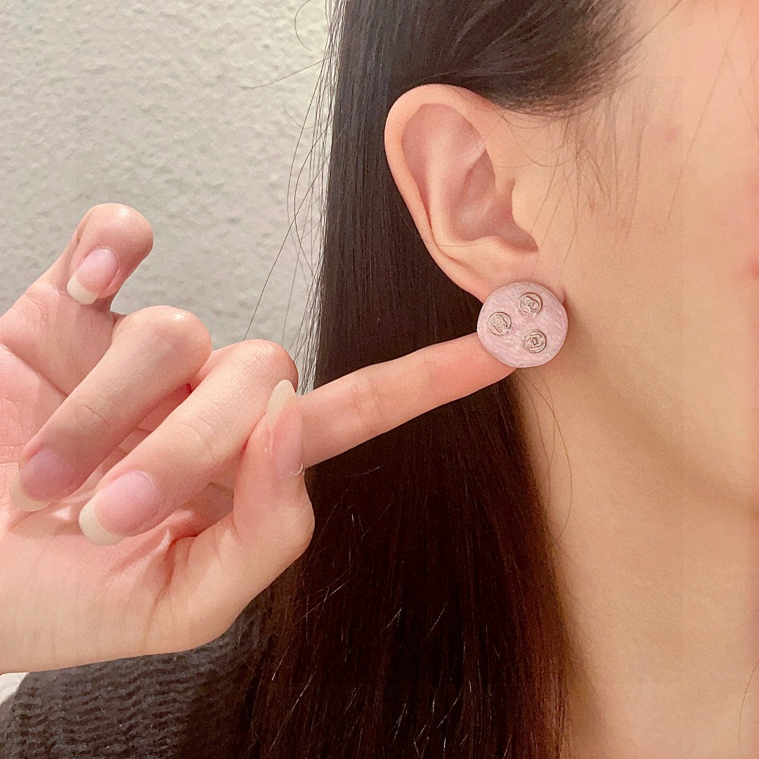Double-C Emblem Stud Earrings in Polished Metal-Tone – Design 123 front product view