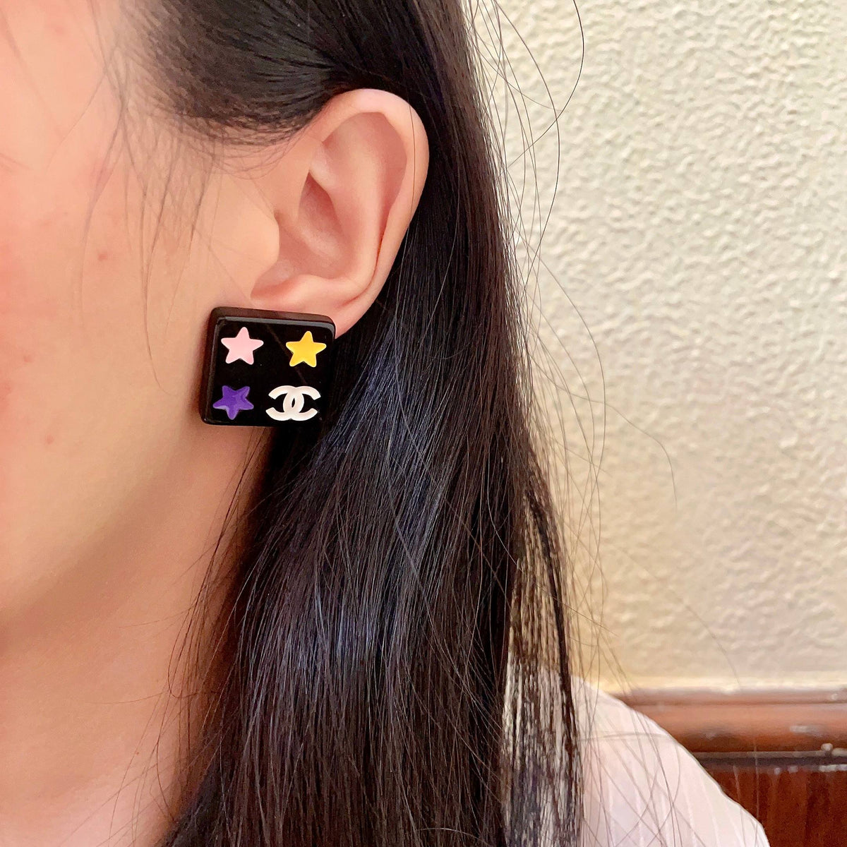 Double-C Emblem Stud Earrings in Polished Metal-Tone – Star Detail – Design 004 detail view