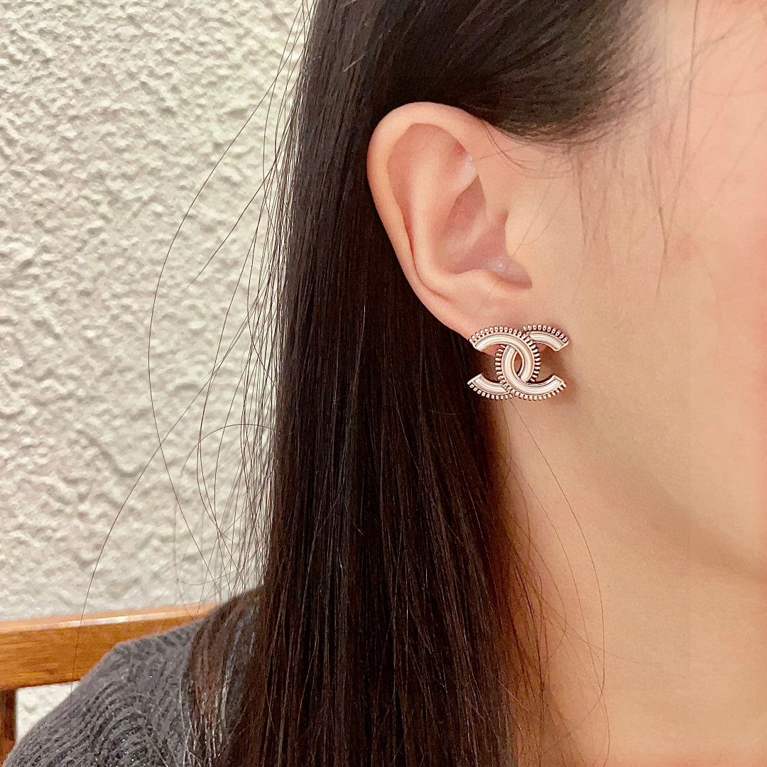Double-C Emblem Stud Earrings in Polished Metal-Tone – Design 195 detail view
