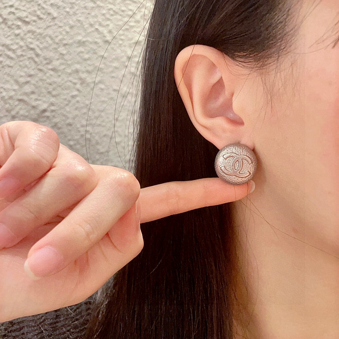 Double-C Emblem Stud Earrings in Polished Metal-Tone – Design 206 front product view