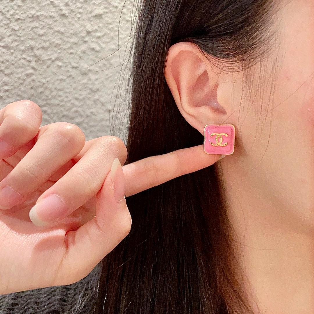 Double-C Emblem Stud Earrings in Polished Metal-Tone – Design 249 front product view