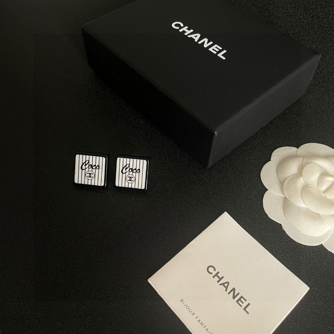 Double-C Emblem Stud Earrings in Polished Metal-Tone – Design 232 close-up detail