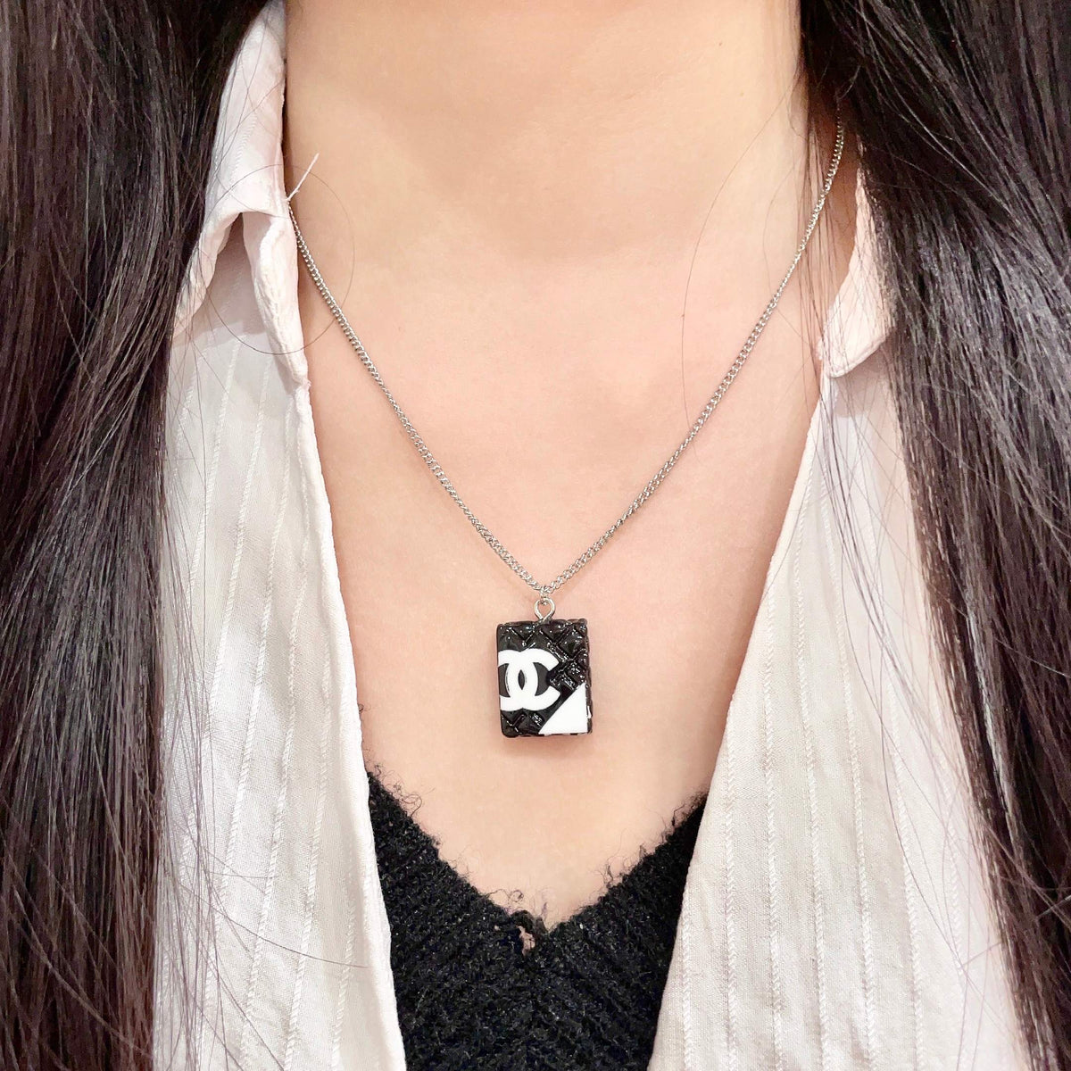 Double-C Emblem Pendant Necklace in Polished Metal-Tone – Design 040 detail view