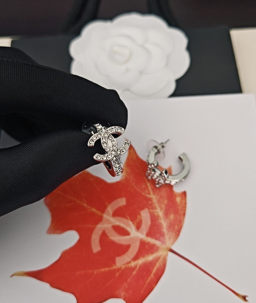 Signature Emblem Jewelry Accessory in Gold-Tone – White Detail close-up detail