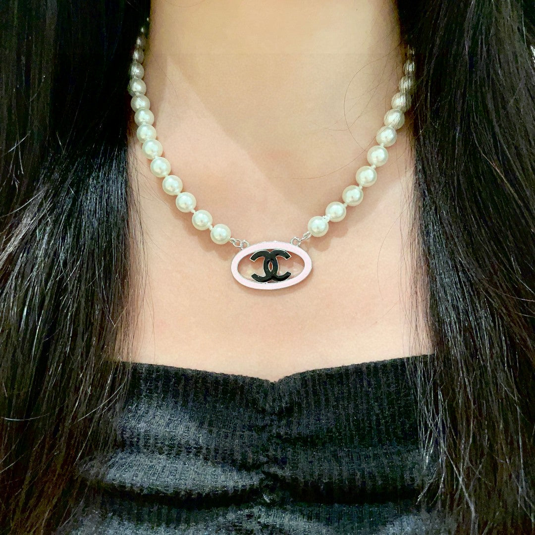Double-C Emblem Pearl-Detail Pendant Necklace – Pearl Detail – Design 120 detail view