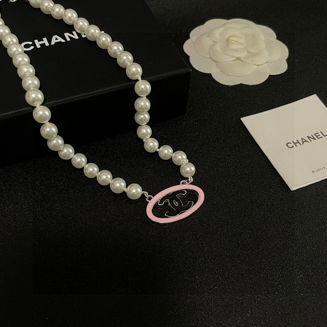 Double-C Emblem Pearl-Detail Pendant Necklace – Pearl Detail – Design 077 styled product view
