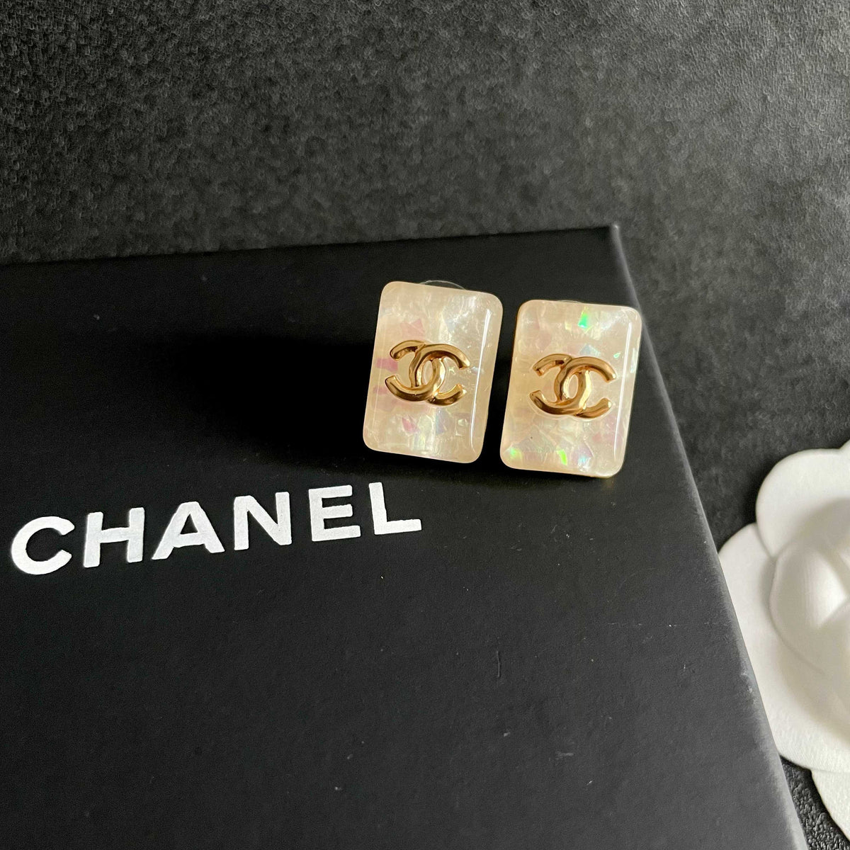 Double-C Emblem Stud Earrings in Polished Metal-Tone – Design 410 detail view