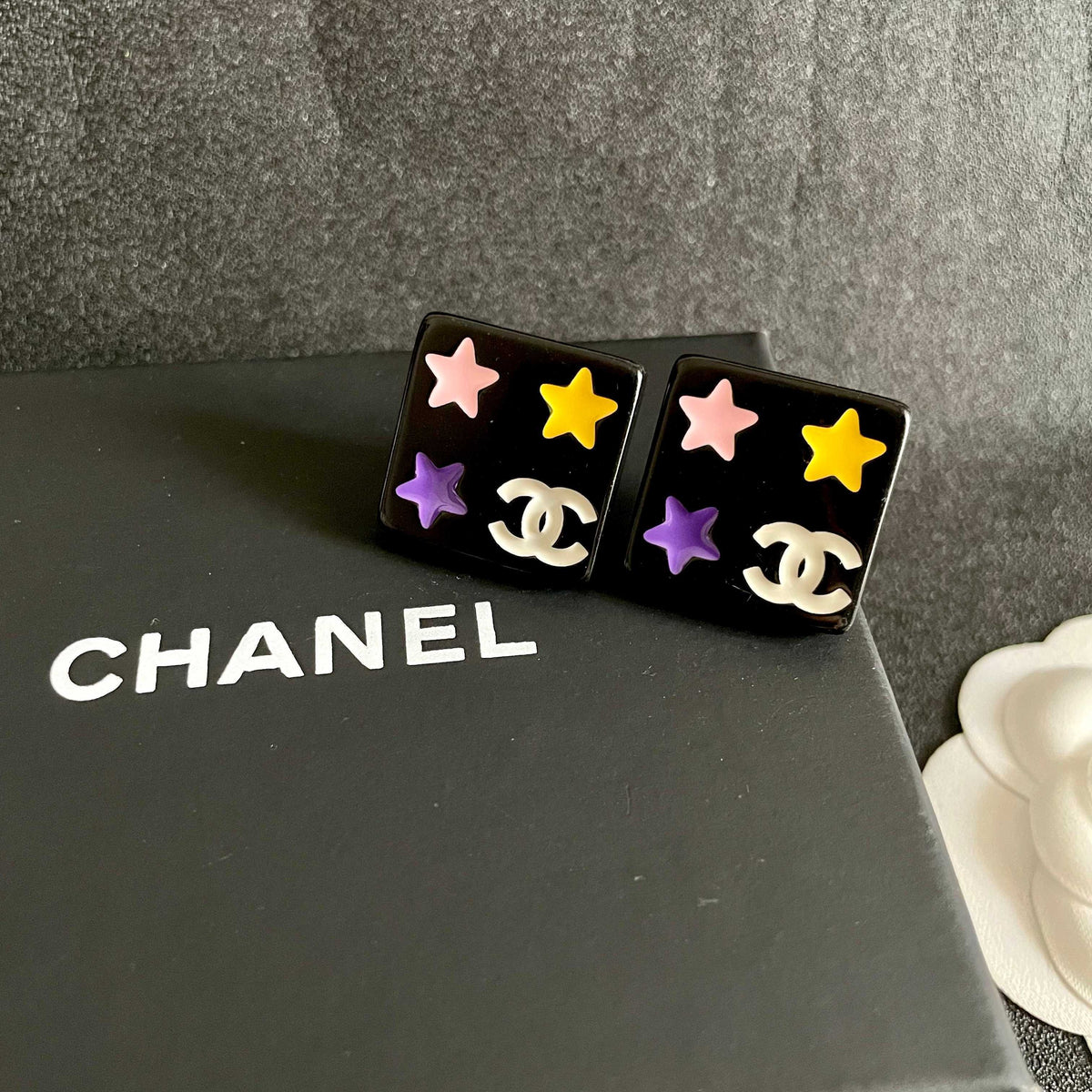 Double-C Emblem Stud Earrings in Polished Metal-Tone – Star Detail – Design 010 detail view