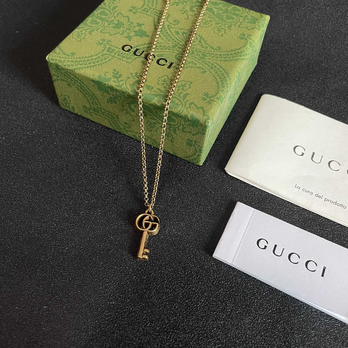 Double-G Emblem Pendant Necklace in Polished Metal-Tone – Design 112 close-up detail