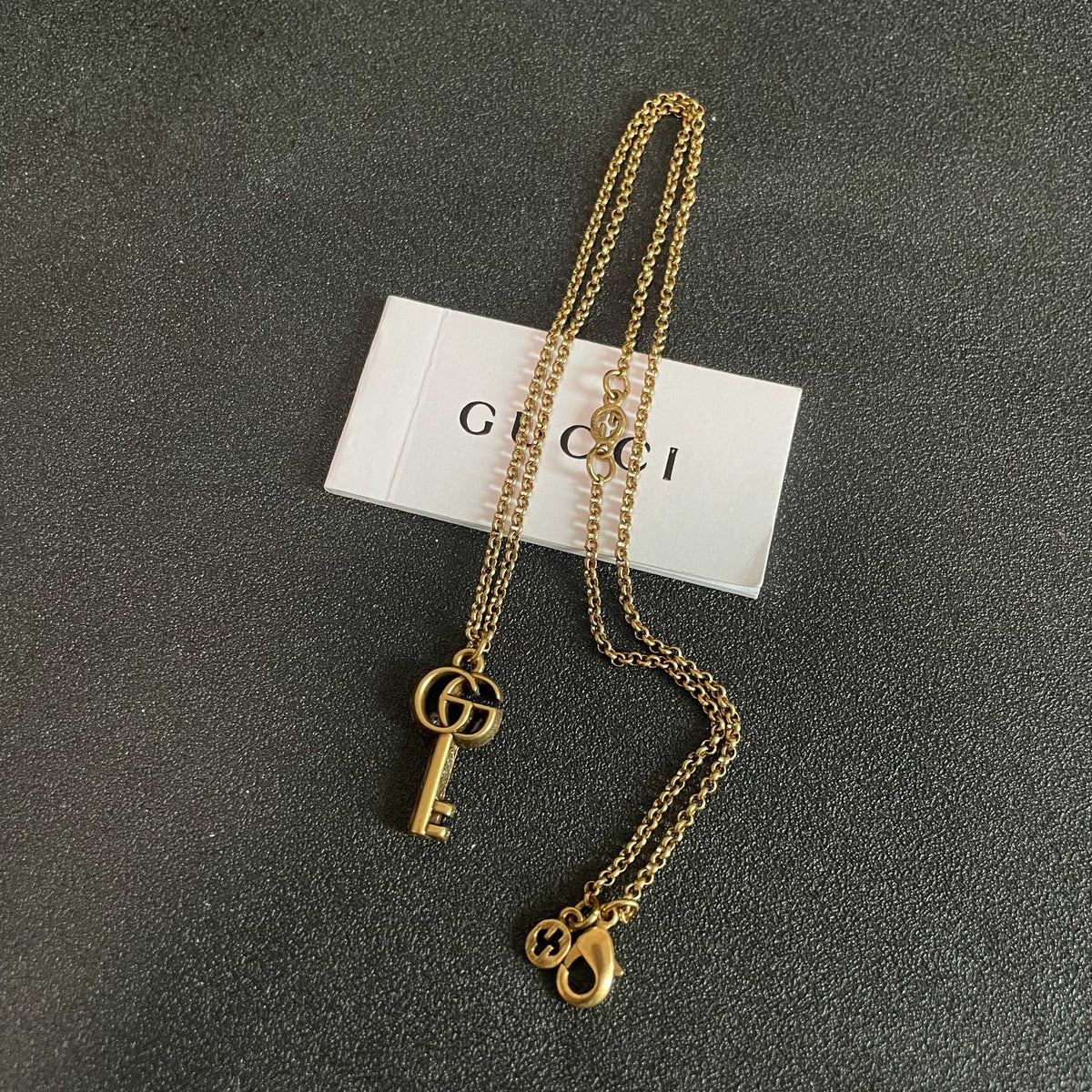 Double-G Emblem Pendant Necklace in Polished Metal-Tone – Design 112 detail view