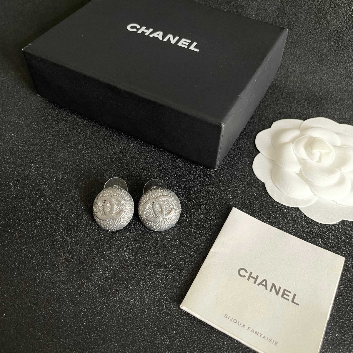 Double-C Emblem Stud Earrings in Polished Metal-Tone – Design 206 close-up detail