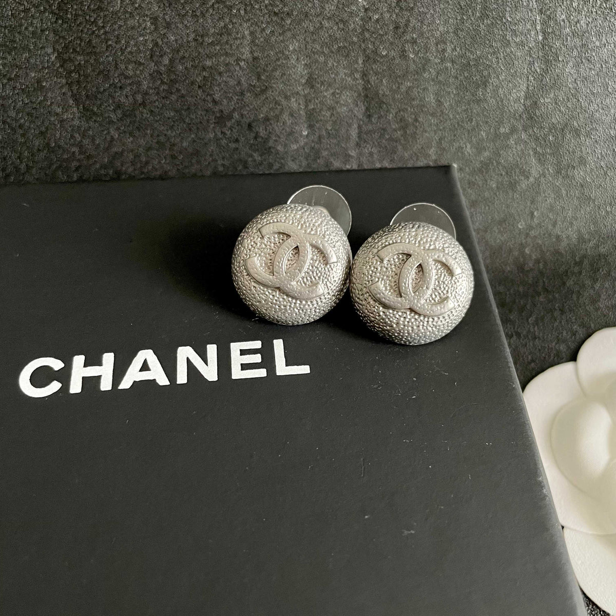Double-C Emblem Stud Earrings in Polished Metal-Tone – Design 206 detail view