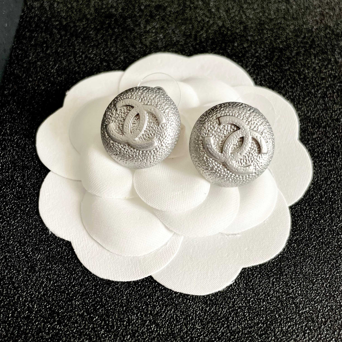 Double-C Emblem Stud Earrings in Polished Metal-Tone – Design 206 front product view