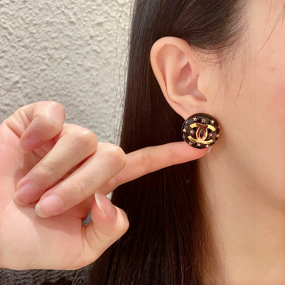 Double-C Emblem Stud Earrings in Polished Metal-Tone – Star Detail – Design 014 front product view