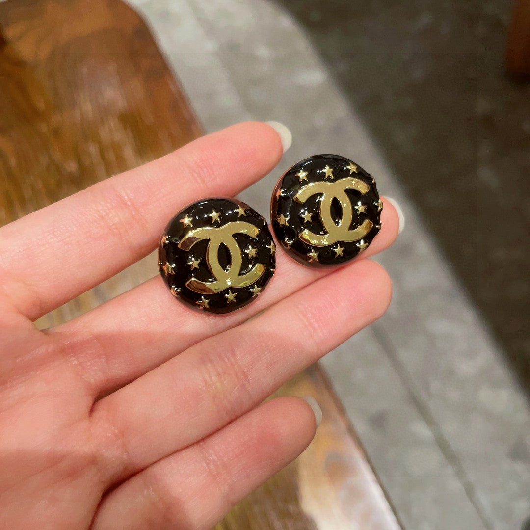 Double-C Emblem Stud Earrings in Polished Metal-Tone – Star Detail – Design 014 side detail