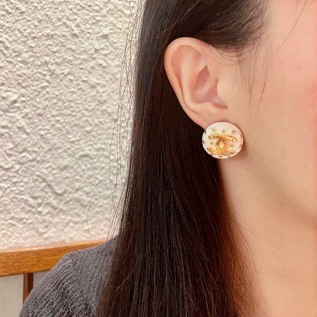Double-C Emblem Stud Earrings in Polished Metal-Tone – Star Detail – Design 017 detail view