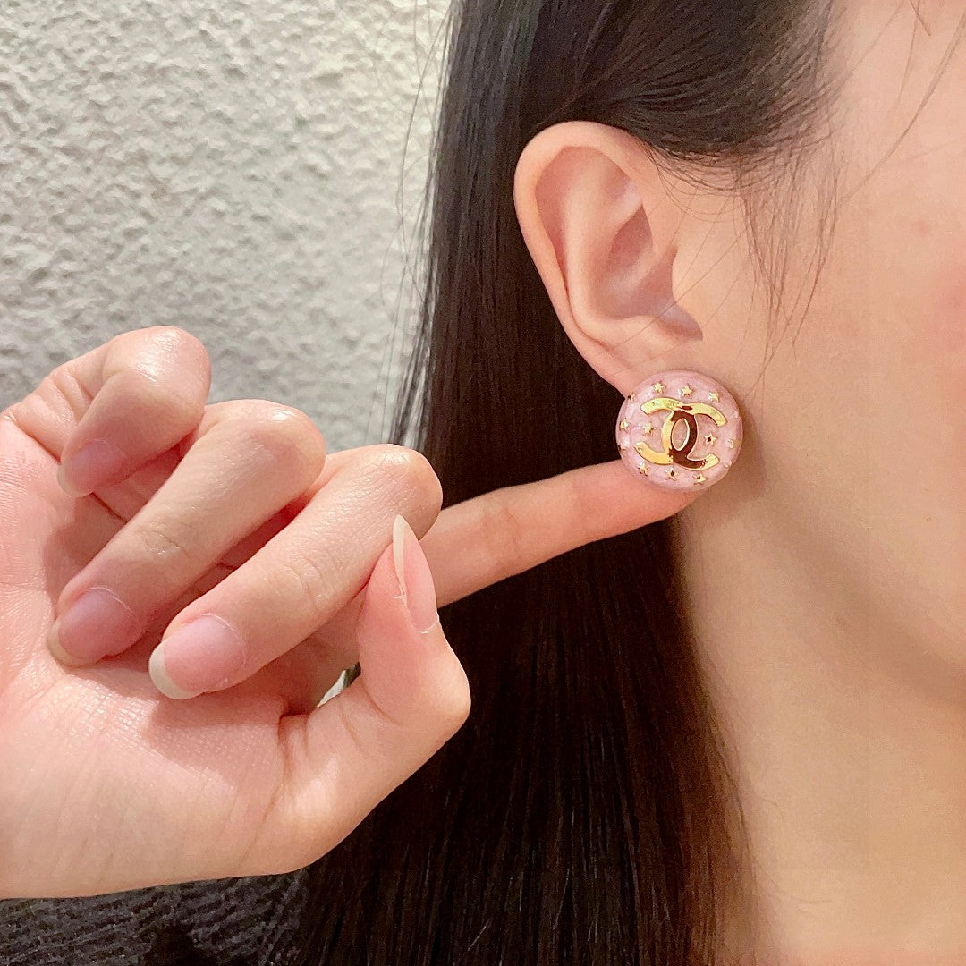 Double-C Emblem Stud Earrings in Polished Metal-Tone – Star Detail – Design 016 front product view