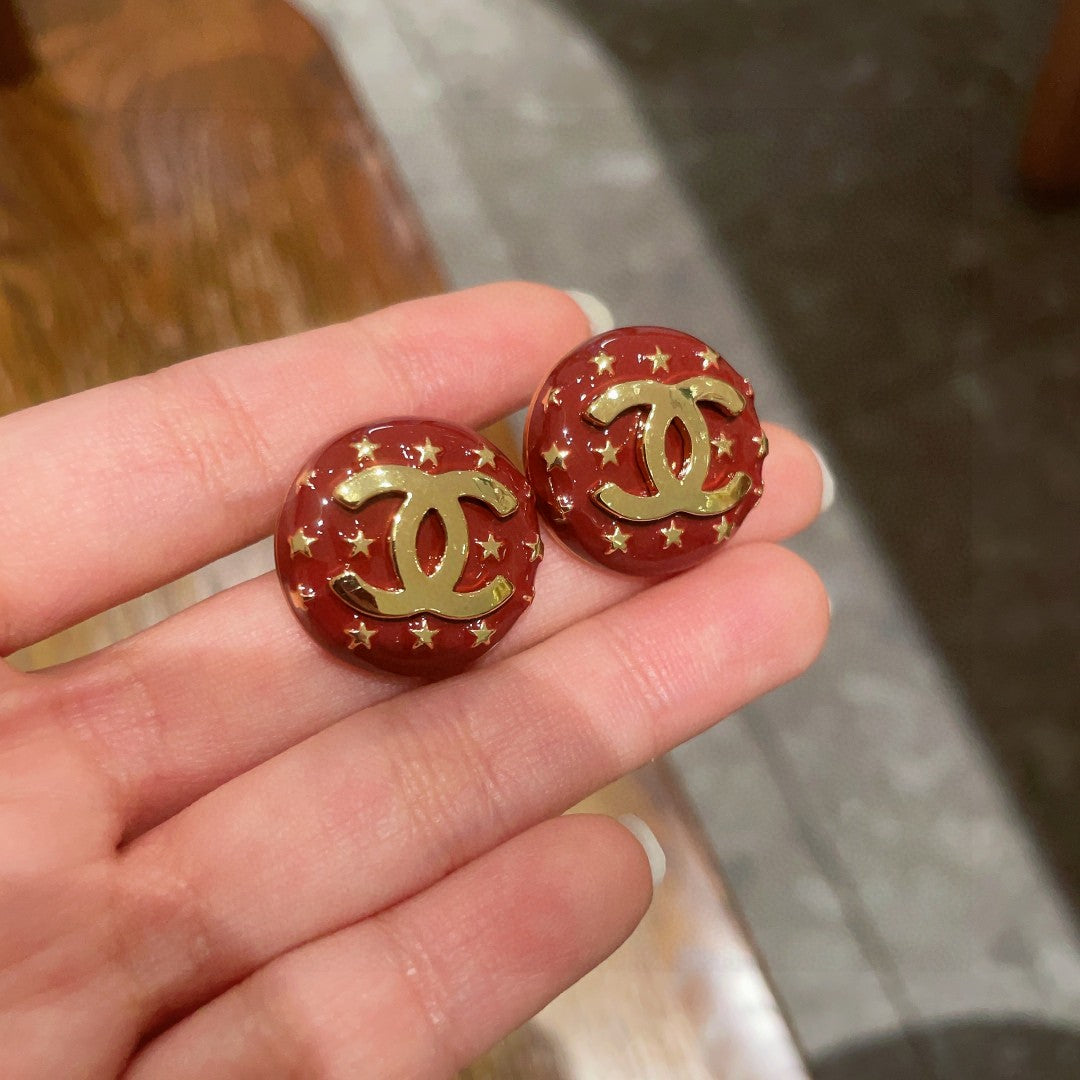 Double-C Emblem Stud Earrings in Polished Metal-Tone – Star Detail – Design 011 side detail