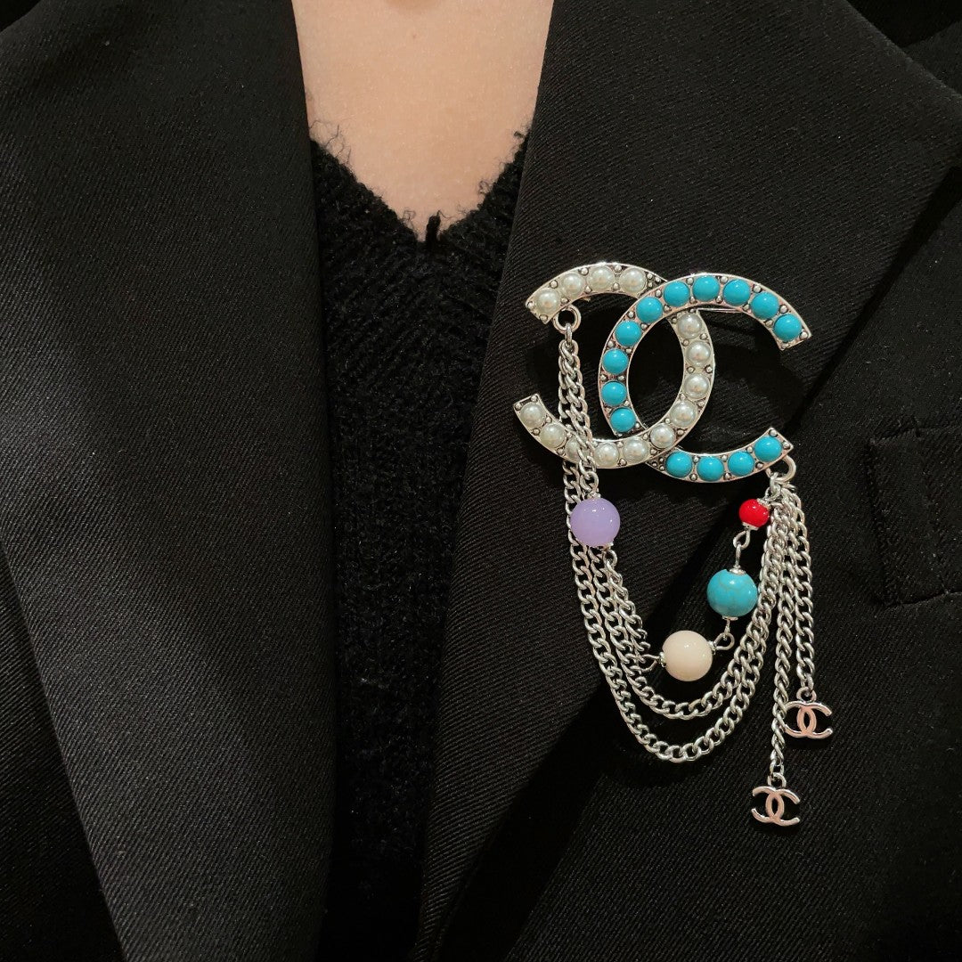 Signature Emblem Brooch in Polished Metal-Tone – Design 030 front product view