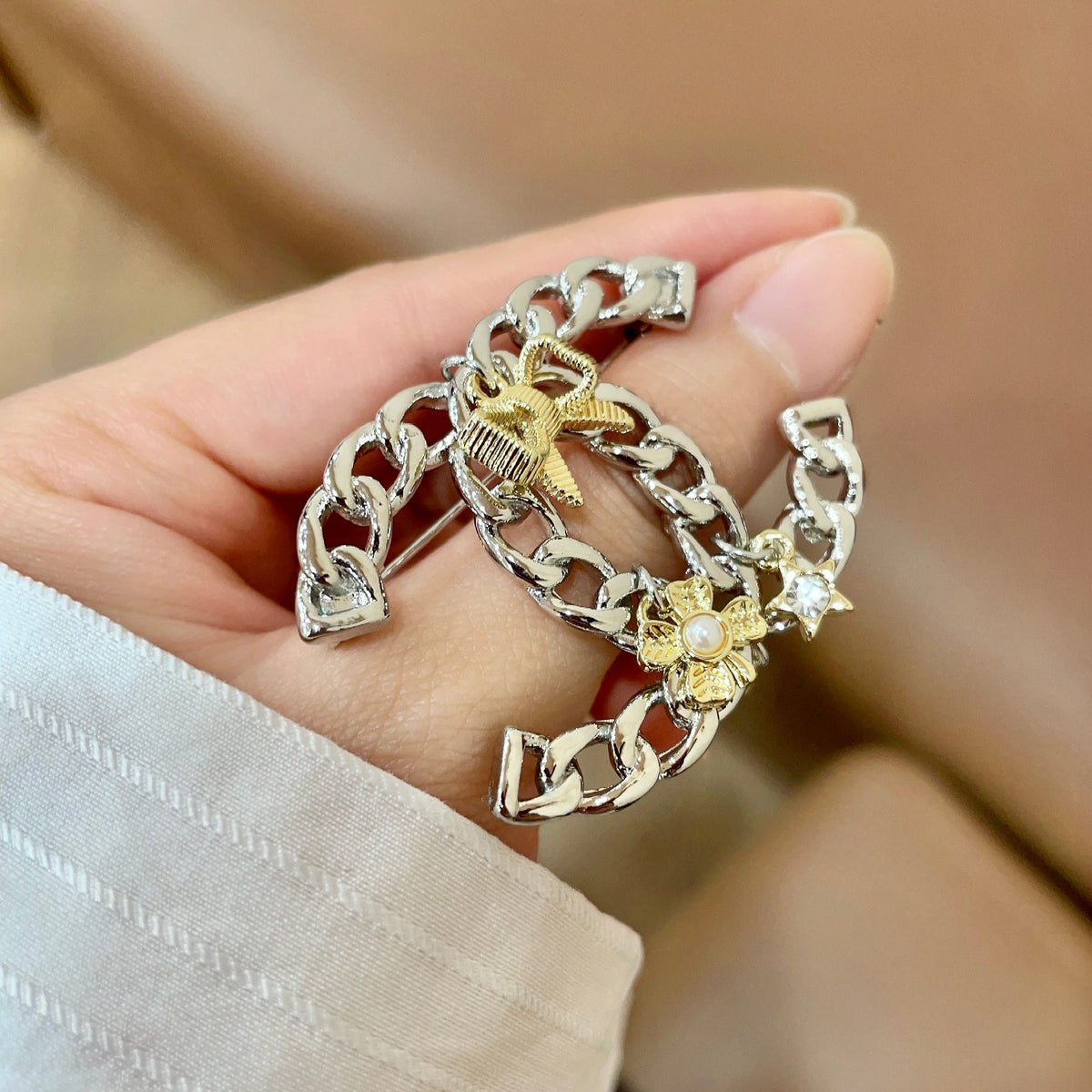 Signature Emblem Brooch in Polished Metal-Tone – Design 029 detail view