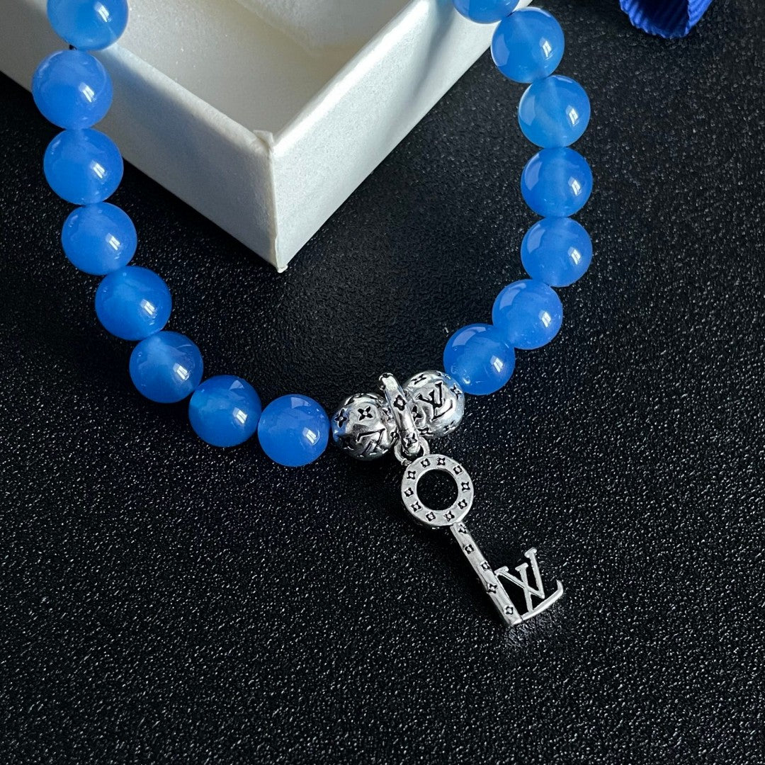 Letter Emblem Bracelet in Polished Metal-Tone – Pearl Detail – Design 002 main product view