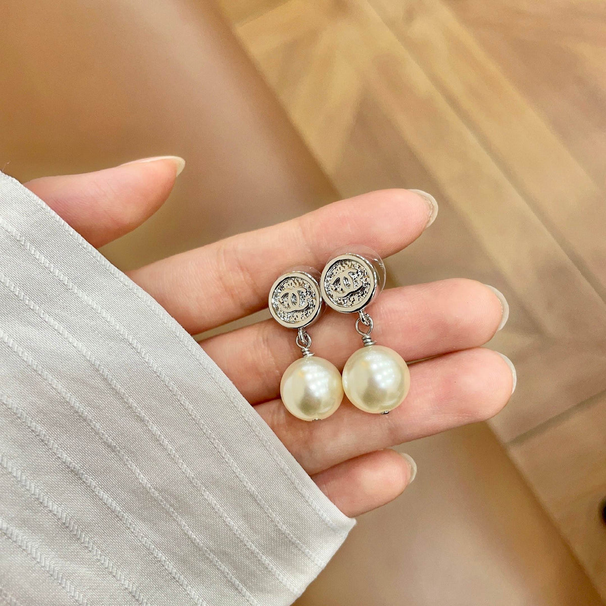 Signature Emblem Stud Earrings in Polished Metal-Tone – Design 040 side detail
